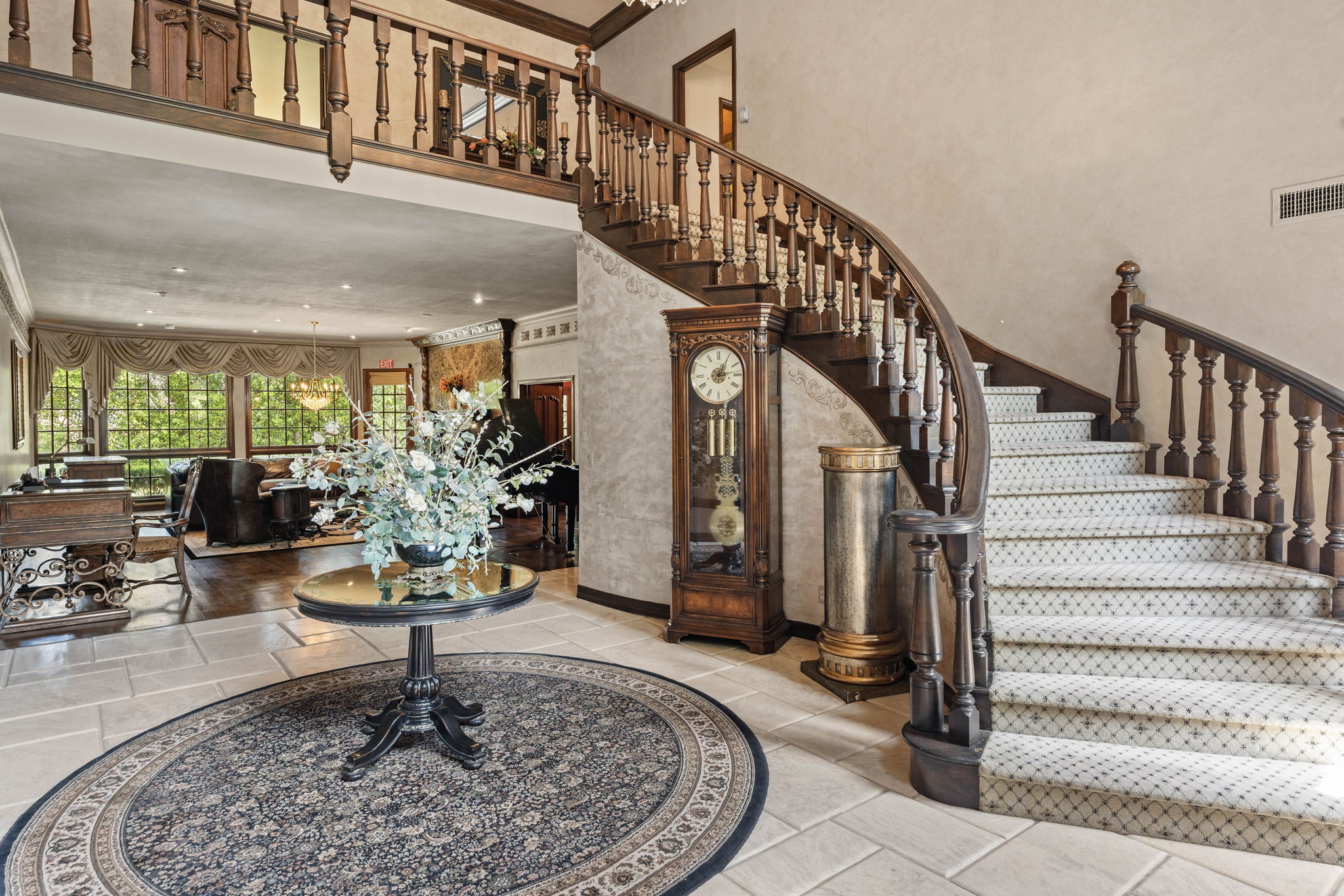 Grand curved staircase in the main foyer of Chelsea Manor