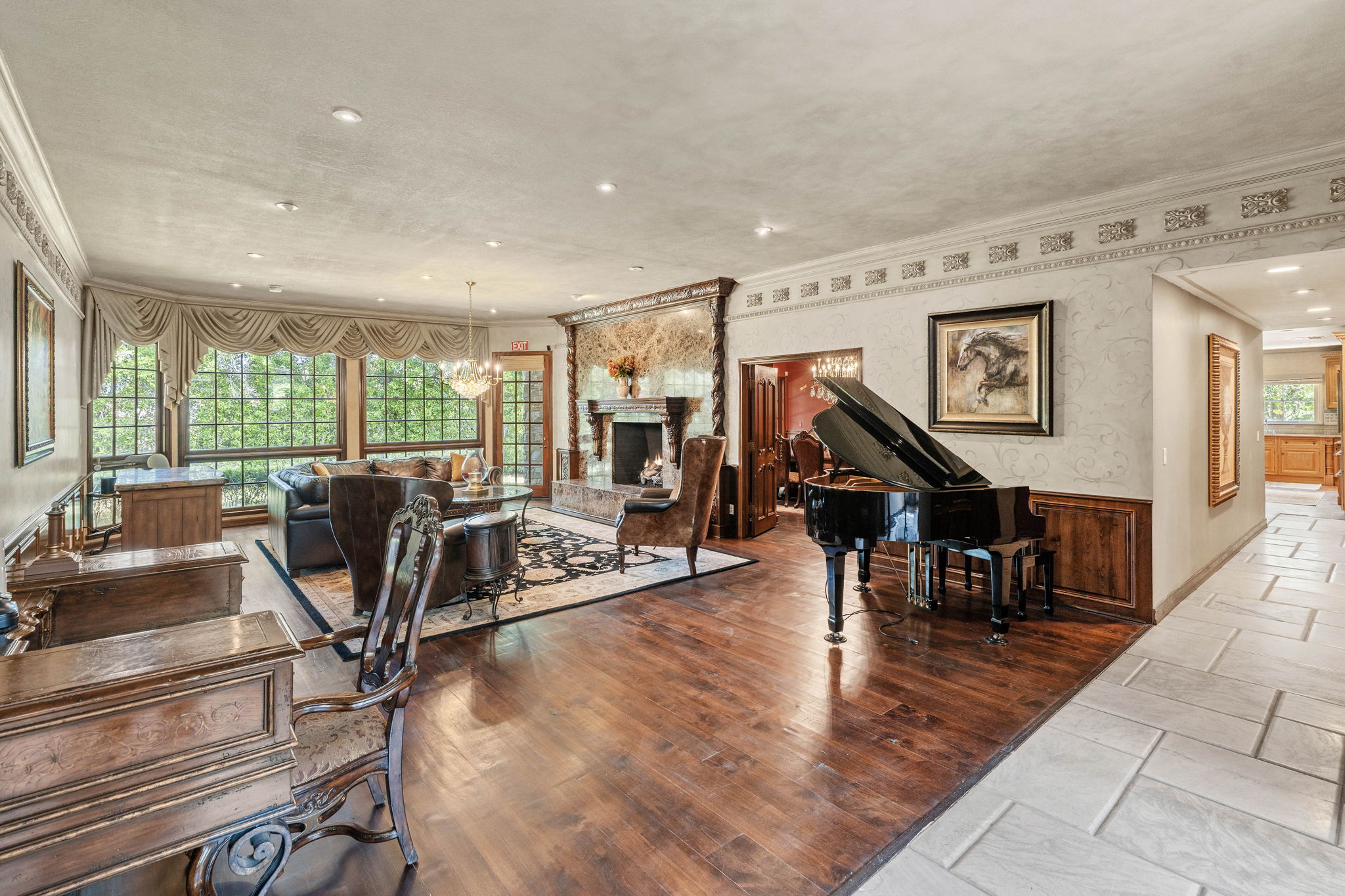 Expansive great room featuring a grand piano and open layout