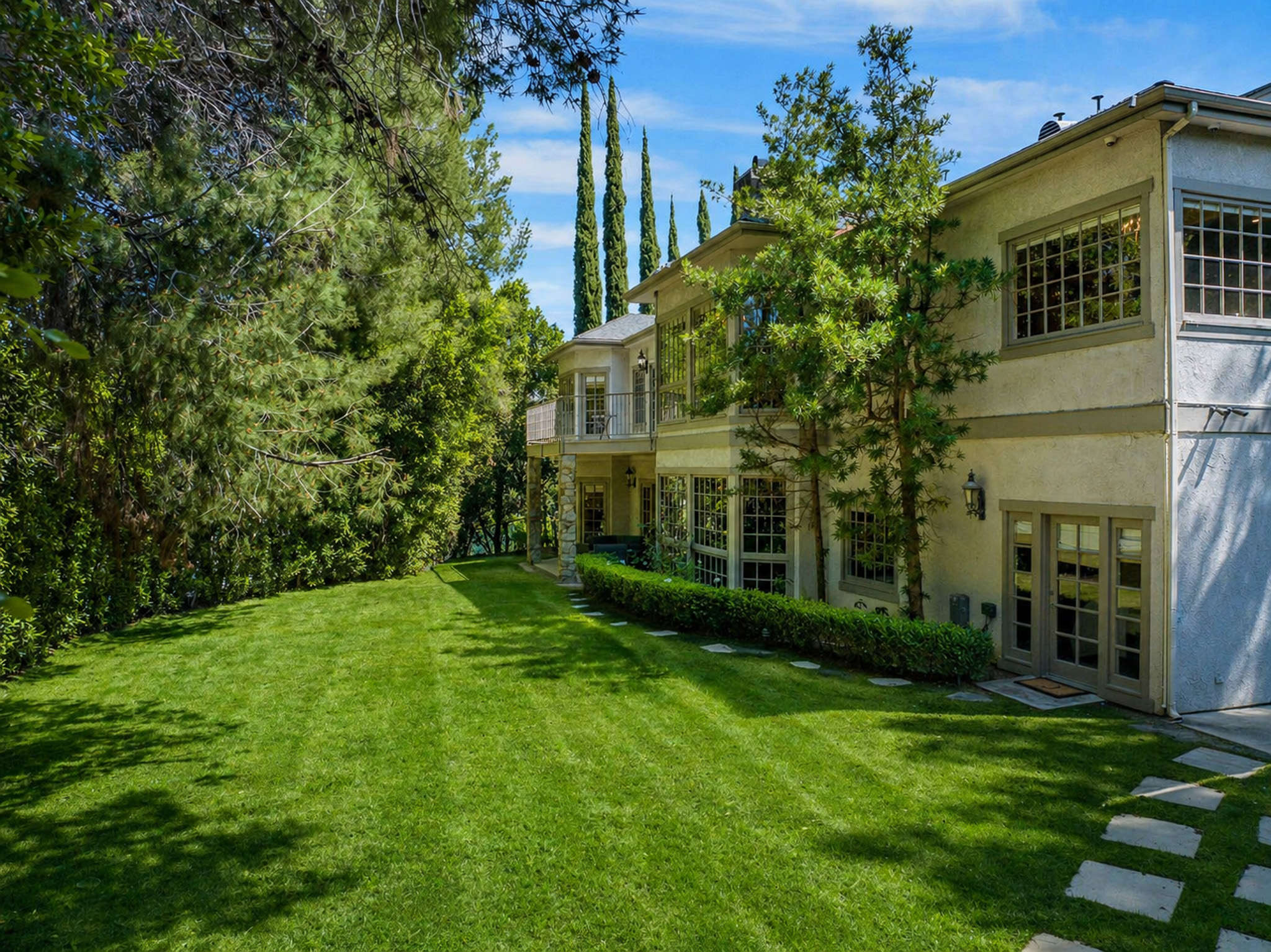 Open estate lawn at the rear of Chelsea Manor Recovery