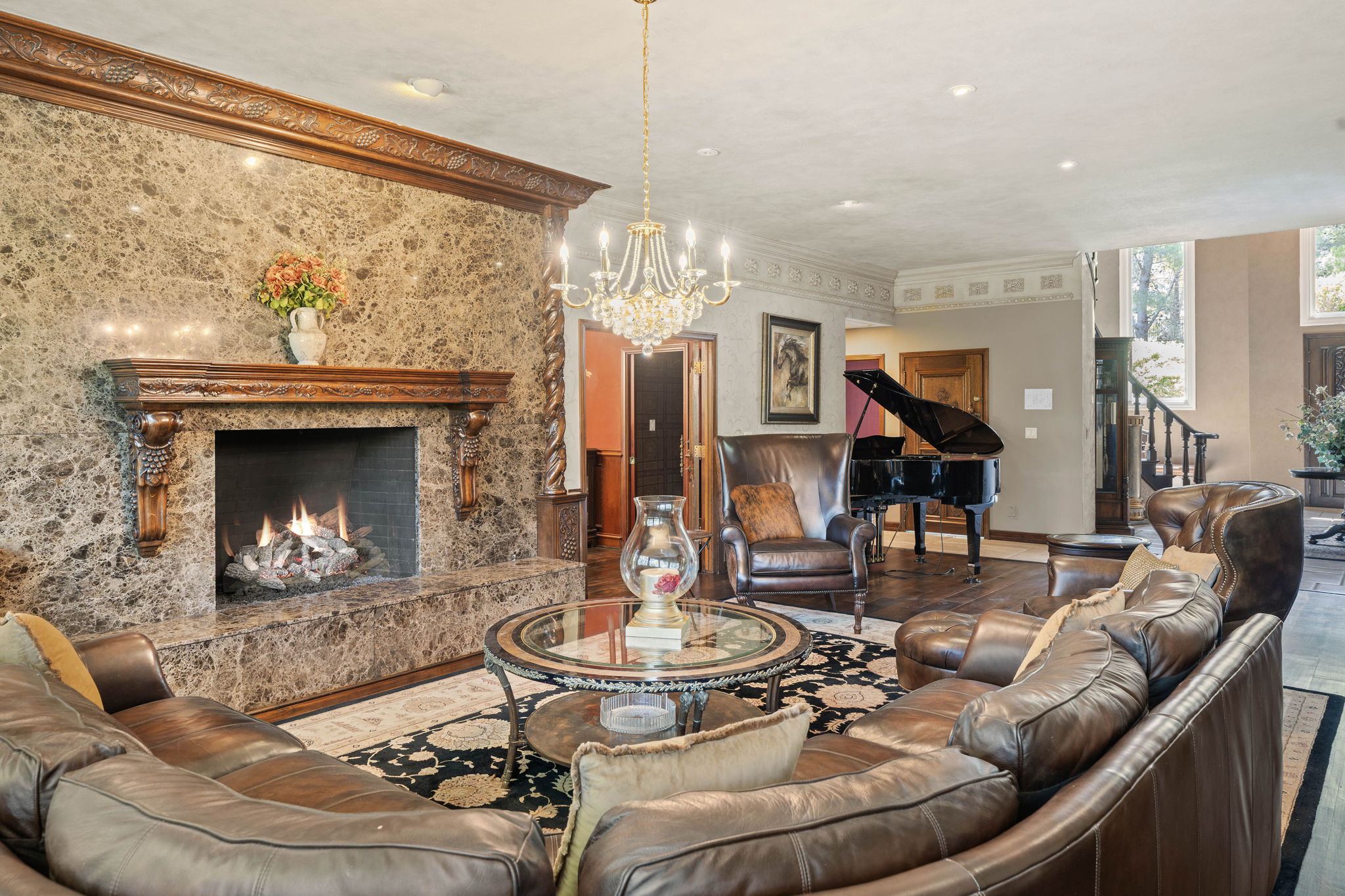 Lounge area centered around a marble fireplace