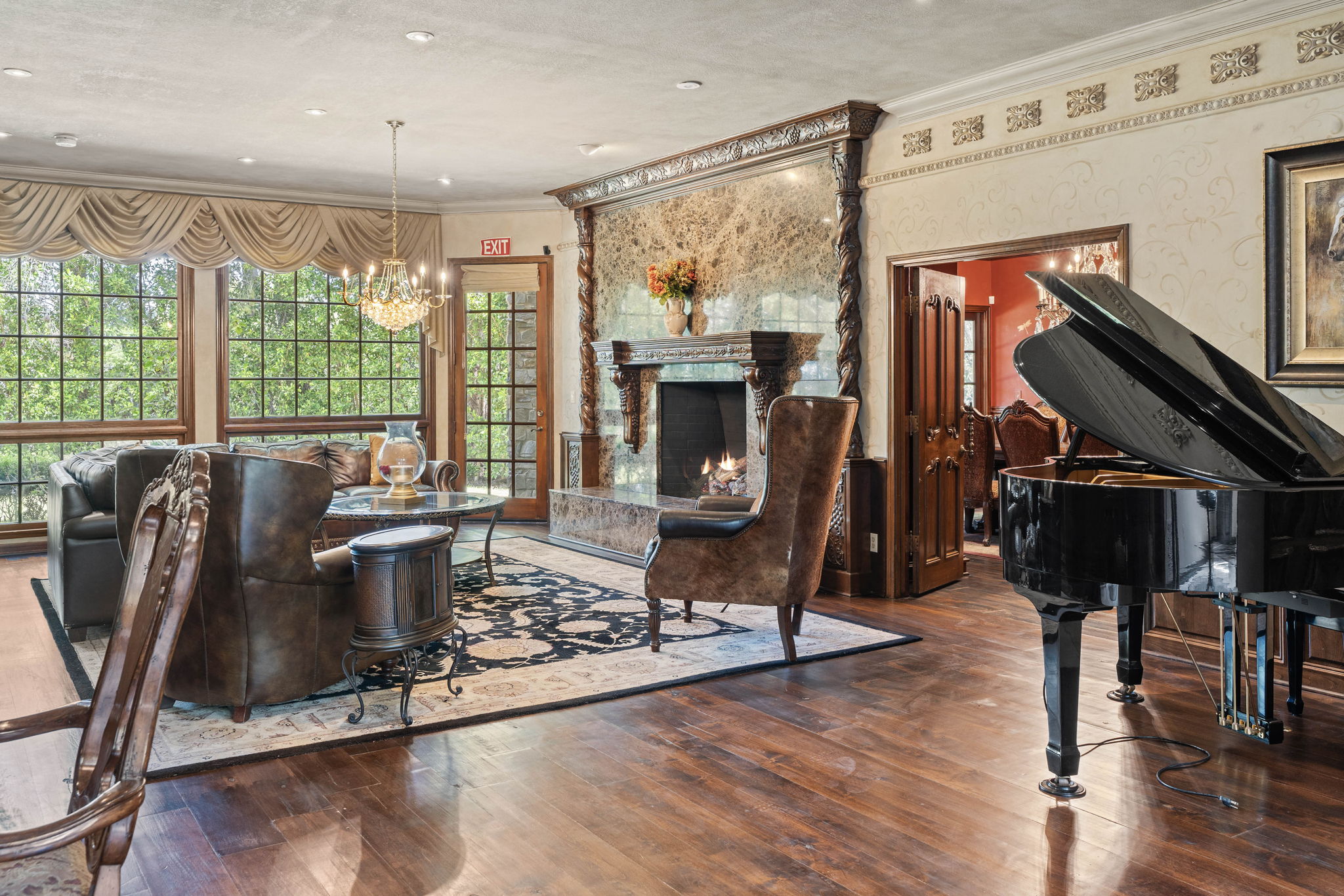 Grand lounge with piano and stone fireplace