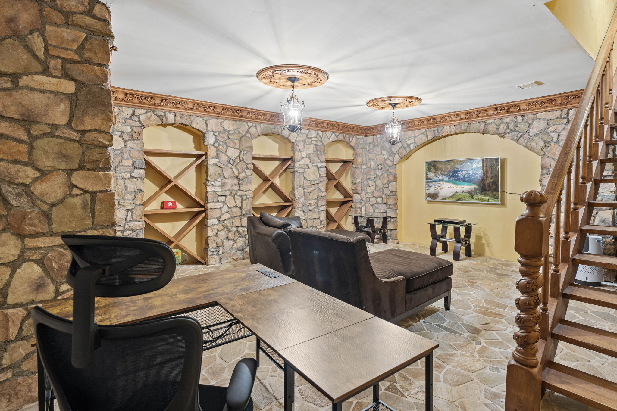 Intimate stone grotto study with arched stonework and warm lighting